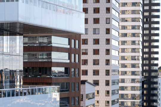 Modern urban residential architecture apartment building facade windows in Stockholm Liljeholmskajen district of Sweden with reflective surfaces
