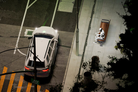 3D android waiting on bench beside rainy street