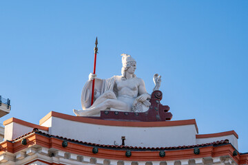 Queen Teuta statue on a historic building in Durr&euml;s.
Cultural heritage and cityscape concept. Copy space.