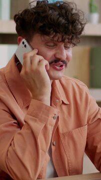 Happy Caucasian business man talking mobile phone in company at table corporate workplace businessman talk call smartphone communicating enjoy conversation specialist smiling guy male smile in office