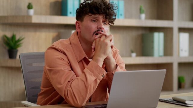 Caucasian businessman typing laptop holding head thinking problem tired stressed business man with computer suffering failure complicated work task male guy working fail startup bankruptcy in office