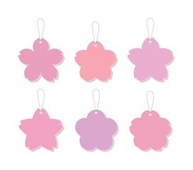 Set of 6 pink cherry blossom gift tags with strings. Various sakura flower shaped paper labels in soft pastel colors, perfect for spring wedding favors, birthday gifts, and seasonal packaging. © Tuesday04