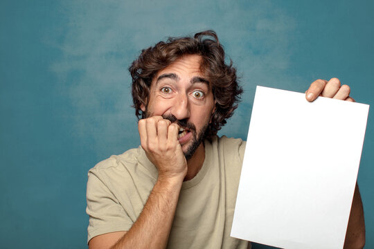 young adult bearded man with a sheet of paper