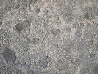 Lunar surface with impact features, Detailed view of lunar landscape with basins and regolith © Vladimir