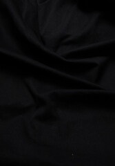 deep black fabric background copy space.