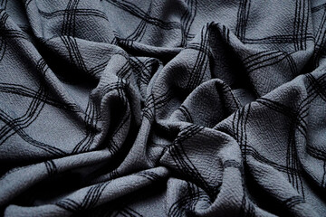 Grey Black white squared pattern table cloth seen from top. Monochrome gray Fabric wave for background. Crumpled cloth abstract texture. Wrinkled fashion fabric. Broken.