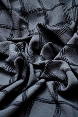 Grey Black white squared pattern table cloth seen from top. Monochrome gray Fabric wave for background. Crumpled cloth abstract texture. Wrinkled fashion fabric. Broken.