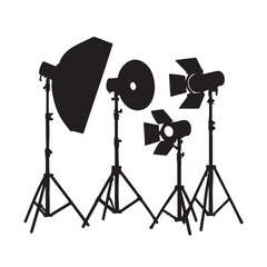 Professional photography and film studio lighting equipment silhouette set on tripods
