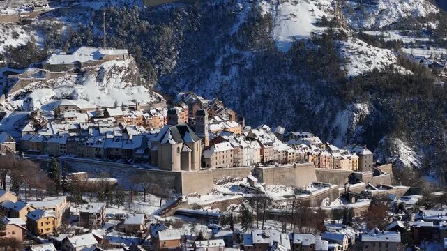 Aerial view of Briancon's old town surrounded by snow-capped mountains, a serene and historic landscape, Briancon, Provence-Alpes-Cote d'Azur, France.
