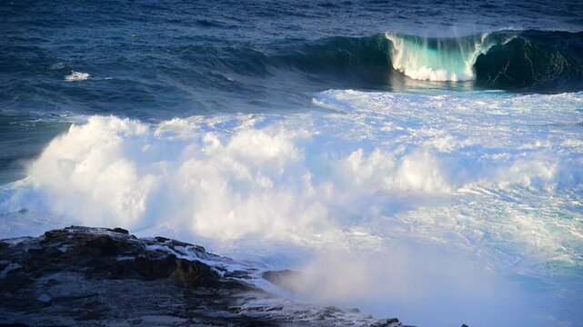 Cinematic aerial of massive Atlantic waves crashing on Gran Canaria coast with dangerous swell and red flag sea conditions