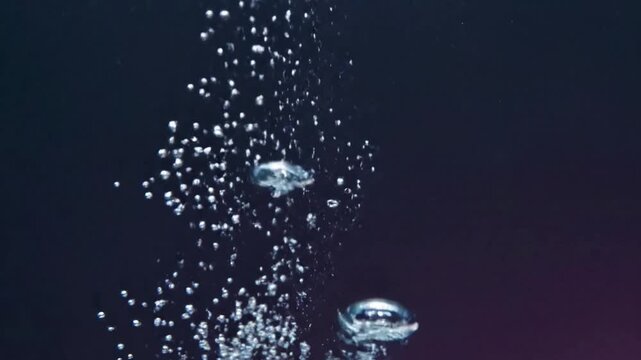 Underwater Ascent A steady stream of small, luminous bubbles rising gracefully through clear, deep blue water, catching and refracting ambient light from above. Focus on the upward motion and clarity.