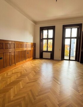 Sunlight bathes the empty room's parquet floors, whispering tales of bygone Viennese Waltz nights and autumn equinox musings
