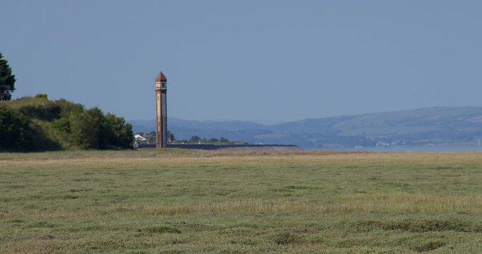 Extra wide shot of Rampside Leading Light take from the carpark on Roa island road.