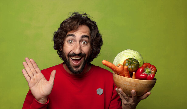 young adult bearded man with vegetables