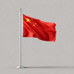 Chinese national flag waving on a silver pole against a neutral gray background from a straightforward viewpoint