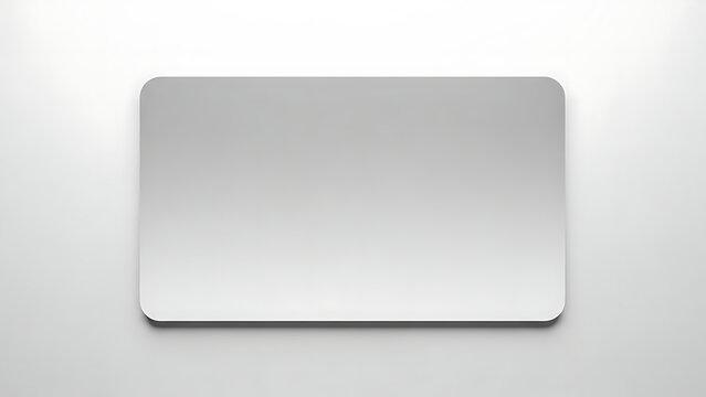Blank silver credit card with rounded corners on a white background, representing financial transactions and modern payment methods.