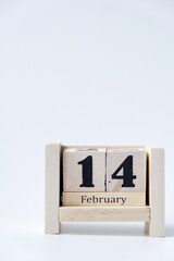 Wooden block calendar for February 14 isolated on white background
