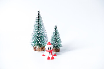 Decorative mini christmas tree with snowman isolated on white background