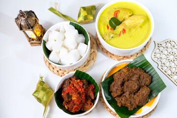 The dishes served during Eid celebrations are rendang, dendeng balado, opor ayam, and ketupat. Isolated on white background