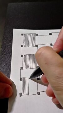 A woman&rsquo;s hand draws a Zentangle pattern with a black-ink ballpoint pen on paper, representing art therapy for relaxation, mental health support, and improved focus.