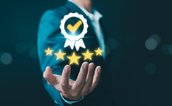Business professional presenting five star rating with quality badge, concept of customer satisfaction, service excellence, trusted brand, business reputation, performance and success achievement.