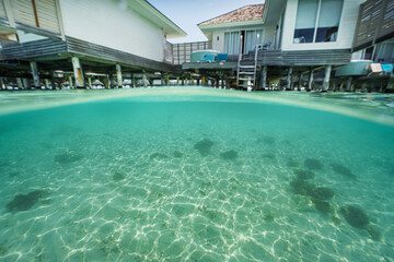 Obraz premium Beautiful maldives tropical island at the water bungalow - clean, clear water underwater.