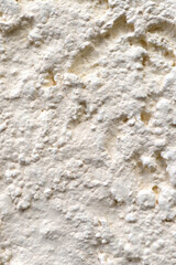 Close up image of rough white wall