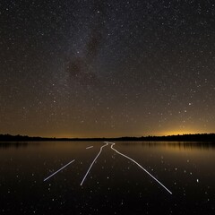 Stars in the night sky reflecting on the water (2)