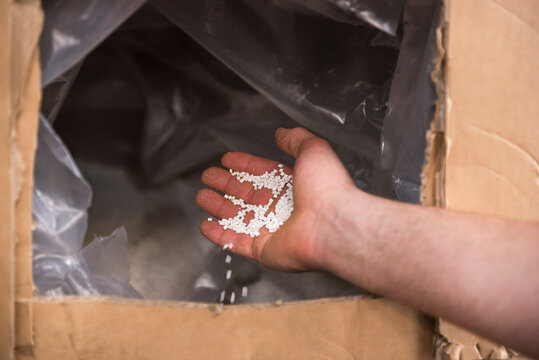 Close-up of hand with packing material