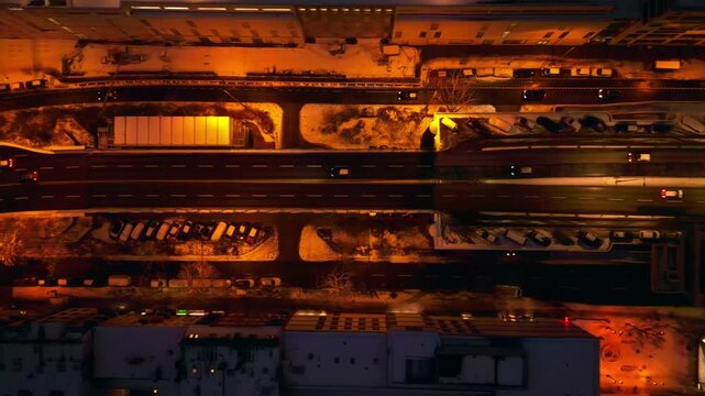 Berlin illuminating shopping street snowed at night. Best aerial view drone