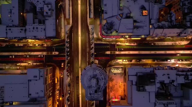 Berlin illuminating shopping street snowed at night. Perfect aerial view drone