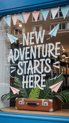 Obraz premium Shop window display with suitcase, tropical leaves, and 