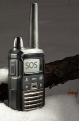 SOS message coming in on a handheld transceiver in the snow