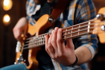 Obraz premium Musician's Hands Hovering Above Strings Moments Before Playing a Bass Guitar