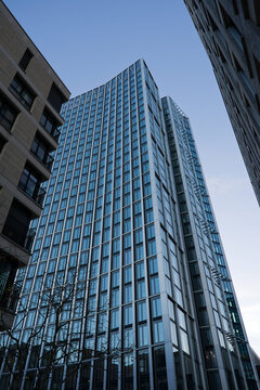 Looking up modern office tower named WINX Tower downtown of German city of Frankfurt on a winter sunset. Photo taken November 22nd, 2025, Frankfurt am Main, Germany.