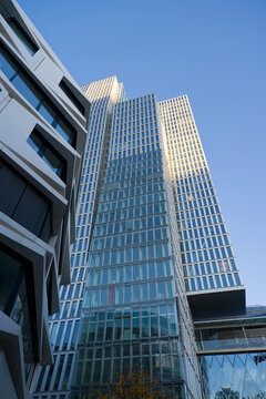 Looking up modern office tower named Nextower downtown of German city of Frankfurt on a winter sunset. Photo taken November 22nd, 2025, Frankfurt am Main, Germany.