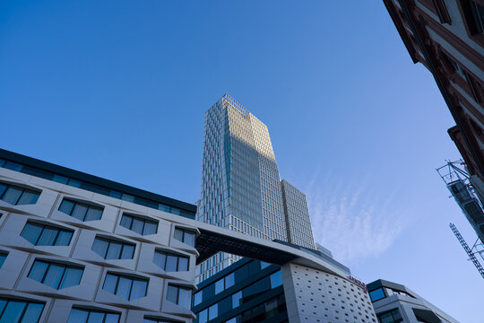 Looking up modern office tower named Nextower downtown of German city of Frankfurt on a winter sunset. Photo taken November 22nd, 2025, Frankfurt am Main, Germany.