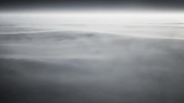 Close-Up Muted Fog Movement An extreme close-up, ground-level perspective, emphasizing the slow, organic, and continuous movement within a dense layer of muted fog, creating abstract textures.