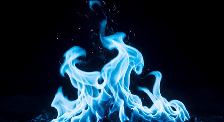 Fototapeta premium Blue flame on dark black background