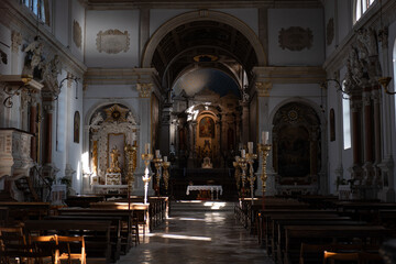 Fototapeta premium Interior of St Georges Parish Church in Piran Slovenia featuring ornate altar arches and sacred details reflecting Catholic heritage faith and historic architecture