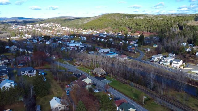 Panoramic view of the residential area of ​​the town of Causapscal, crossed by the legendary and touristy Route 132, and the Matapedia salmon river in autumn. Gasp&eacute; Peninsula, Quebec, Canada, 2025.