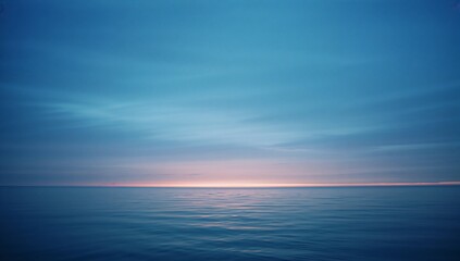 Obraz premium Serene ocean landscape with calm waters and vibrant sky at dusk