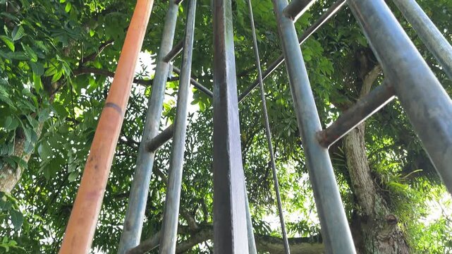 Water well drilling process in a rural tropical area, showing hoses, soil, and equipment during groundwater extraction. The footage documents infrastructure development, access to clean water, and rur