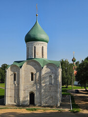 Large green building with a green roof. The roof has a gold top. Transfiguration Cathedral Orthodox church in Pereslavl-Zalessky