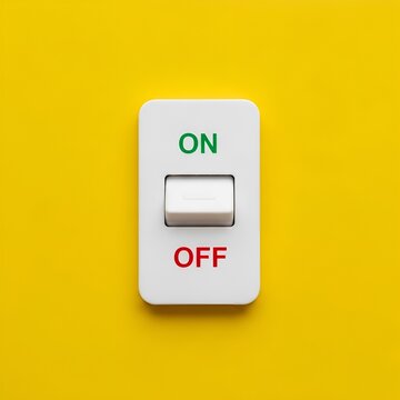 White light switch in on position on yellow background.