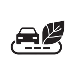 Car silhouette on a road with a large green leaf symbolizing eco-friendly