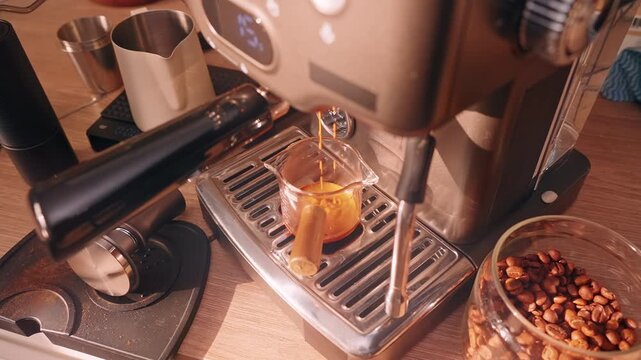 Espresso flowing from Portafilter into Glass Cup during extraction with Warm Light, Slow Motion showing rich liquid stream and brewing process
