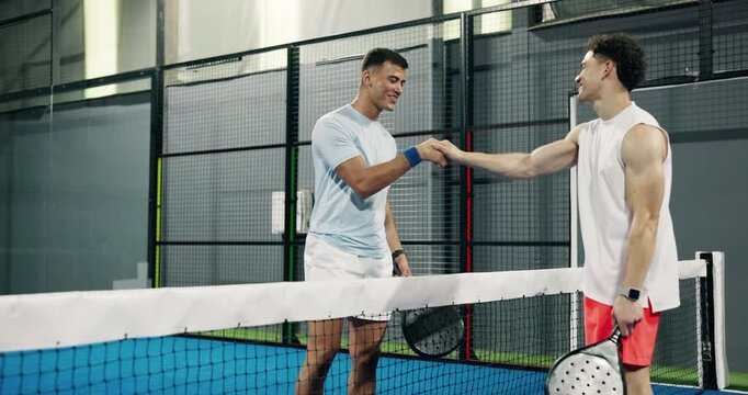 Handshake, sports and friends on padel court for training, workout or match with tournament. Active, shaking hands and male athletes at racket game, practice or exercise at indoor fitness center.