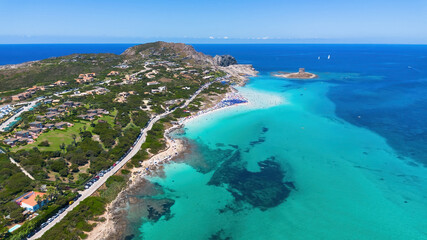 Fototapeta premium Crystal clear turquoise waters and white sands of Spiaggia La Pelosa from above in Sardinia, Italy