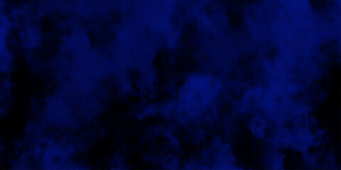 Artificial magic smoke in black and blue light on black background in darkness. light blue and dark blue background. Black and blue Grunge Concrete Wall Texture Background.